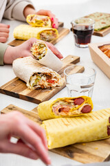 friends eating kebab in cafe