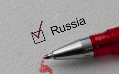 check mark on the word russia and red pen. Closeup, concept