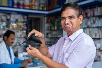 worried consumer after seeing no money on wallet or unable to purchase medicines at medical store...