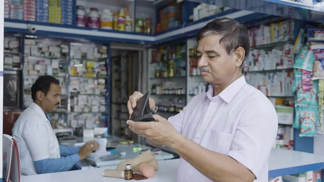 worried consumer after seeing no money on wallet or unable to purchase medicines at medical store - concept of poverty, financial problems and expensive.