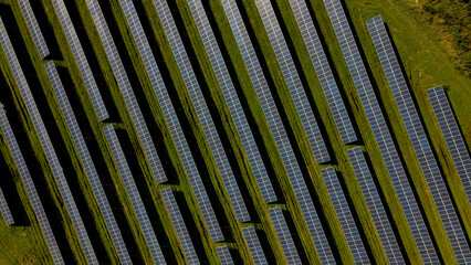 Drone shot of solar panel rows at a solar power facility