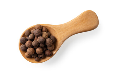 Wooden spice shovel full of allspice pimento berries cutout. Jamaica pepper grains in a wooden spoon isolated on a white background. Natural spice and seasonings for food design.