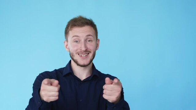 Hey you. Good idea. Inviting gesture. Boomerang motion. Approving satisfied man finger pointing isolated on blue background GIF loop animation.
