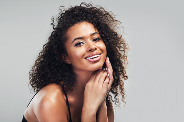 My skin reflects my inner wellbeing. Studio shot of a beautiful young woman posing against a grey background.