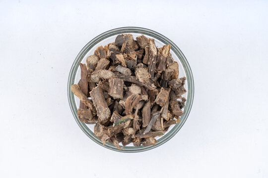  Giloy, also known as Tinospora, Guduchi, Cordifolia Closeup Over isolated White background over glass Bowl