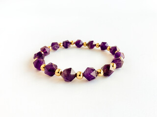 Amethyst Bracelet with Gold Filled Spacer Beads Isolated on White