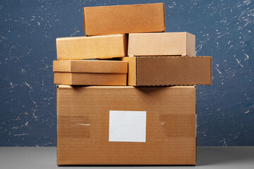 Group of cardboard boxes against blue background