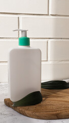 white bottle with organic cosmetics product for home spa with natural ingredients