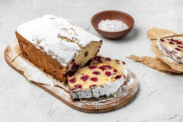 sliced fruit bread with berries for dessert, cupcake sweet bread with cherries, Homemade sponge cake or chiffon cake on white table. Homemade bakery concept, place for text, top view