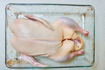 duck carcass in a glass baking dish