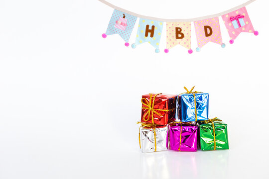 Happy birthday bunting flage with colorful gift box on white background, birthday celebrate