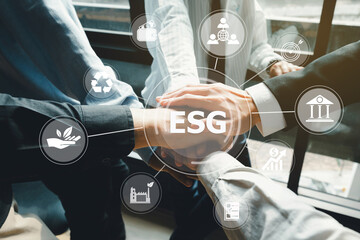 ESG concept. Criteria environmental social and corporate governance in sustainable ethical business.Business team joining hands and representing concept for sustainable business and environment.
