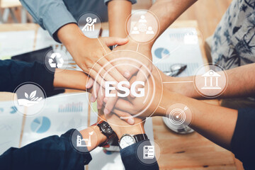 ESG concept. Criteria environmental social and corporate governance in sustainable ethical business.Group of people joining hands and representing concept for sustainable business and environment.