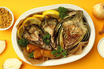 Concept of tasty food with grilled artichoke, top view