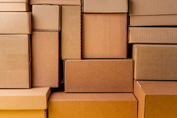 Cardboard boxes stacked in a pile as a background
