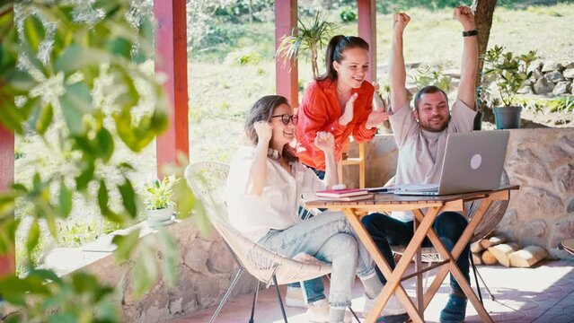 The euphoric excited business team celebrates corporate victory together, happy overjoyed professionals group rejoices company victory, teamwork success wins triumph concept.