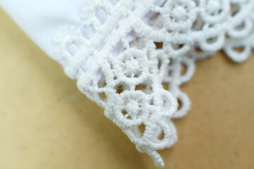 White brocade background, White Prayer hijab brocade detail. Beautiful fabric with fashionable motifs