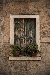 Fototapeta na wymiar A window in an historic building in Torri del Benaco at Lake Garda, in Verona Province, Veneto, north east Italy 