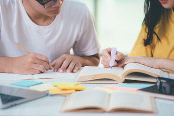 Young students campus helps friend catching up and learning.