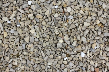 Background of gravel or crushed stone, building material. Lots of small stones.