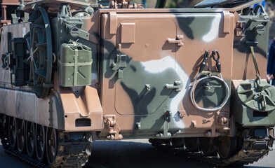 M113 armored personnel carrier, APC. Military parade. War weapon, camouflage vehicle, close up.