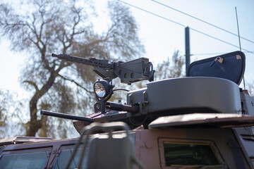 Fototapeta premium Machine Gun turret on an Armored Personnel Carrier. War heavy weapon, army equipment.