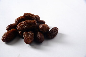 Fresh almonds in the wooden bowl, Organic almonds, almonds border white background, Almond nuts on a dark wooden background. Healthy snacks. Top view. Free space for text.