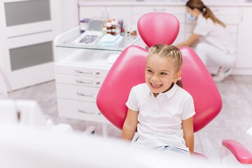 Little girl smiling on a visit to the dentist at the dental clinic