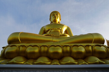 A giant Buddha golden statue is seen at Wat Paknam Phasi Charoen temple located in Bangkok, Thailand. The statue, made of bronze and gold, measures 96 meters tall and 40 meters wide.
