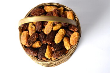 Fresh almonds in the wooden bowl, Organic almonds, almonds border white background, Almond nuts on a dark wooden background. Healthy snacks. Top view. Free space for text.