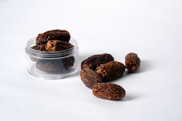 Fresh almonds in the wooden bowl, Organic almonds, almonds border white background, Almond nuts on a dark wooden background. Healthy snacks. Top view. Free space for text.
