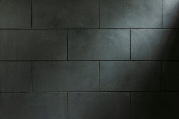Close-up of a block wall and slightly bright lights. Image for background with copy space