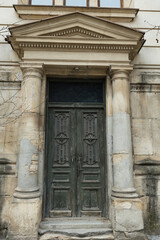 Fototapeta premium Old wooden door in historical building, Bucharest, Romania