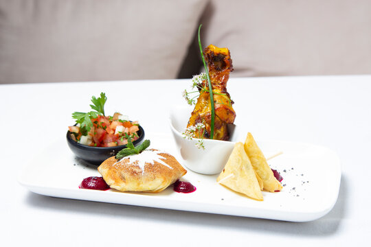 Traditional Moroccan food pastilla, Briouates mini salade and fried chicken leg