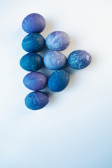 Space colored eggs on white background.