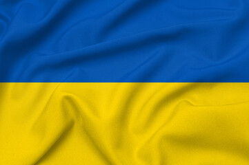 Smooth elegant tissue abstract background in color of ukrainian flag. Textile background. Cloth wallpaper. Graphics design element