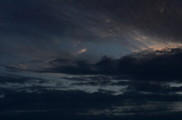 Fototapeta na wymiar Storm Clouds Over a Lake Beach at Sunset