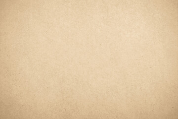 Brown recycled craft paper texture as background. Cream cardboard texture vintage page grunge vignette.