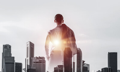 Concept of business success and control with confident boss against cityscape background