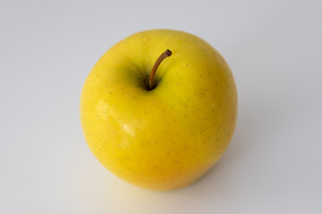 yellow apple on a white background