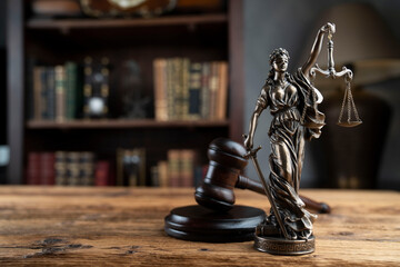 Lawyer office. Law symbols composition: judge’s gavel, Themis sculpture and legal books.