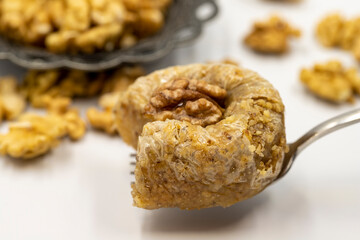 Walnut baklava on a white background. Traditional Turkish cuisine delicacies. Local name is cevizli bülbül baklava