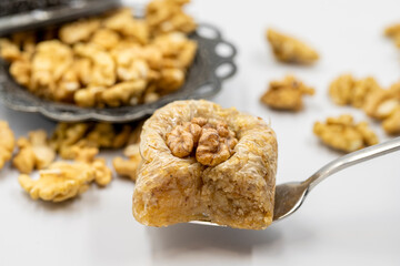 Walnut baklava on a white background. Traditional Turkish cuisine delicacies. Local name is cevizli...