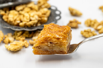 Walnut baklava on a white background. Traditional Turkish cuisine delicacies.
