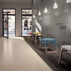 Modern interior design, space with gray and cream tiles, seamless colorful seats, luxurious background.