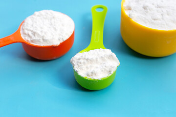 Baking soda on blue background.