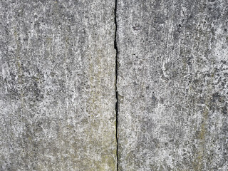 Crack on a grey concrete floor, wall, surface, grey texture