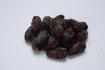 Fresh almonds in the wooden bowl, Organic almonds, almonds border white background, Almond nuts on a dark wooden background. Healthy snacks. Top view. Free space for text.