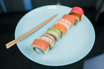 assorted sushi roll with different fillings on a plate japanese cuisine