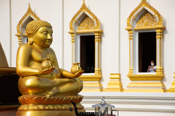 Gautama Buddhist or Gautama Maha Katyayana Buddhism thai name call Phra sangkajai happy and smile buddha for thai people travel visit and respect praying at Wat Tanot temple in Nonthaburi, Thailand